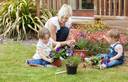 Backyard landscaping in Bickley featuring seating and planting zones